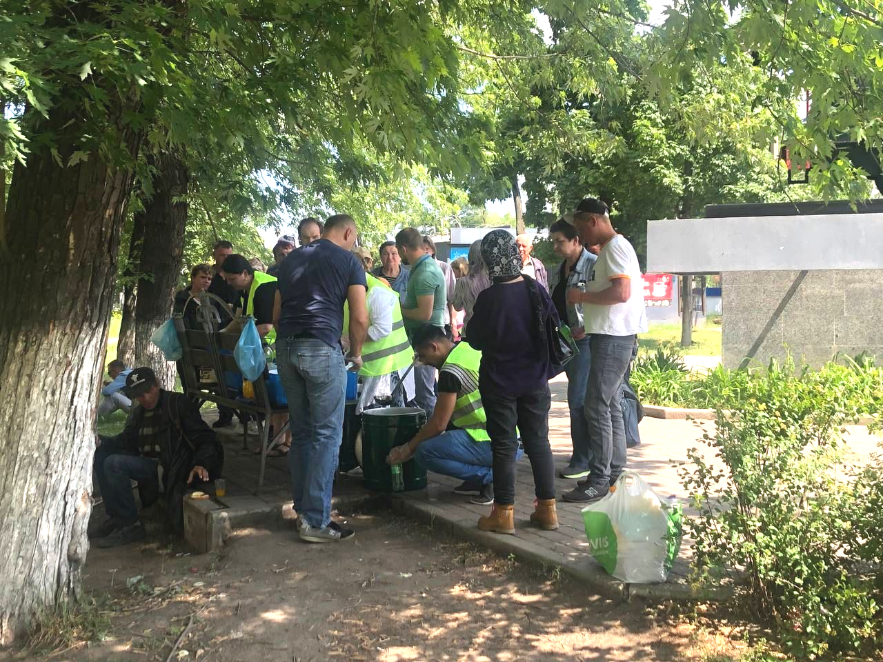 Group of people gathered to receive food