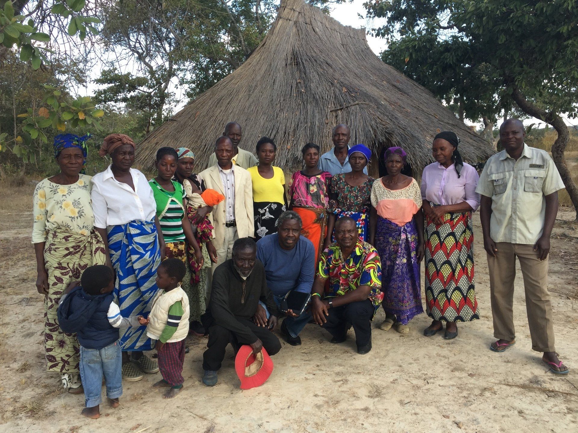 Group of people in front of a small church building