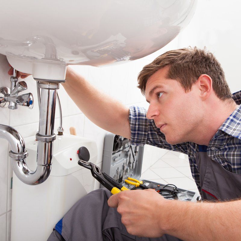 Plumber checking the pipes