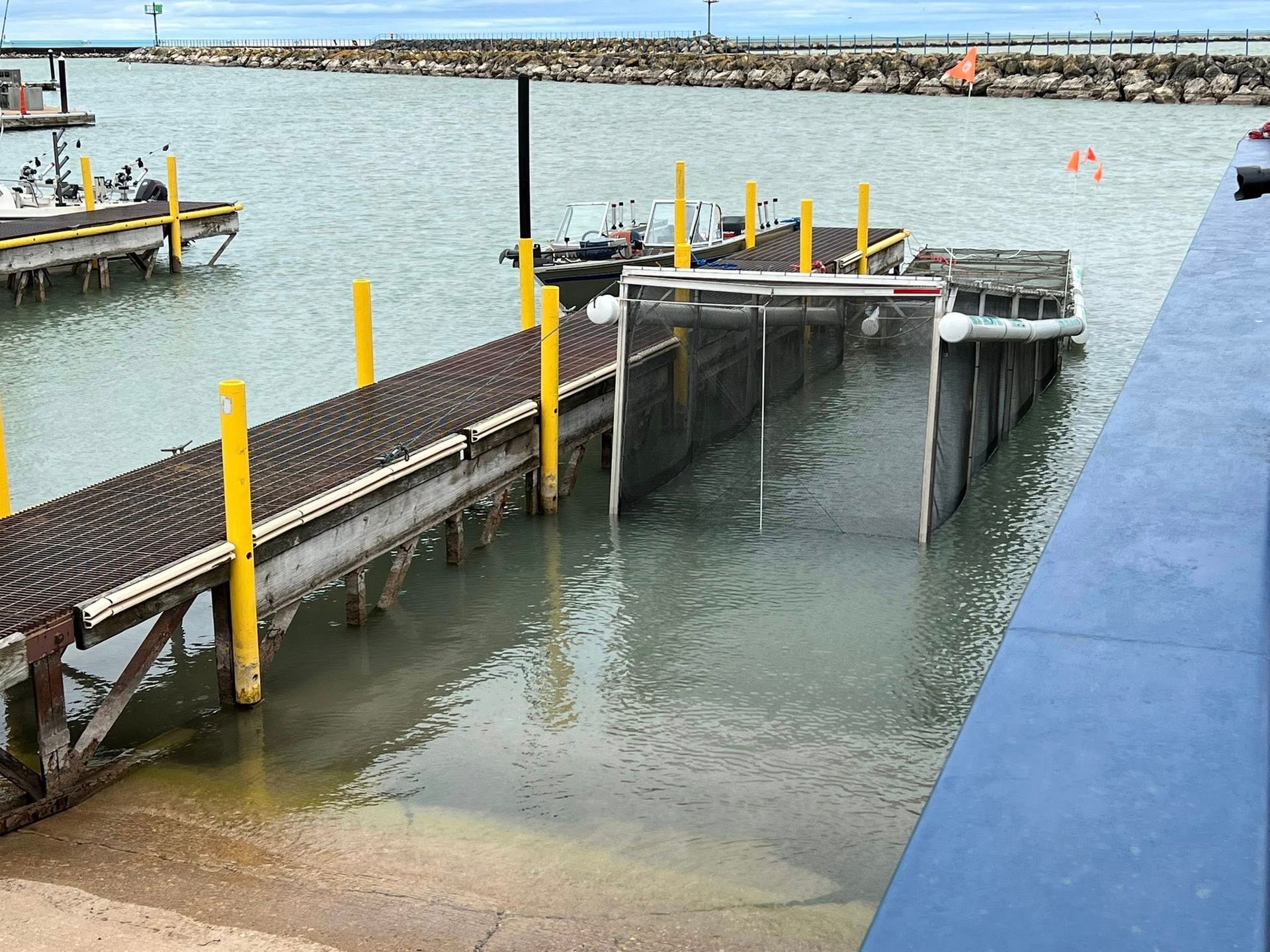 A boat is docked at a dock in the water