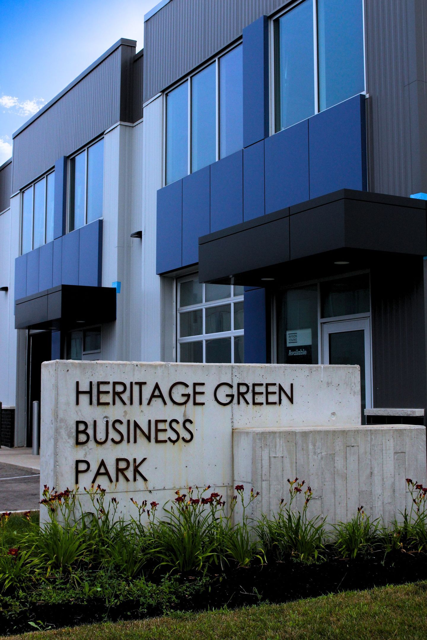 The front entrance sign that says heritage green business park