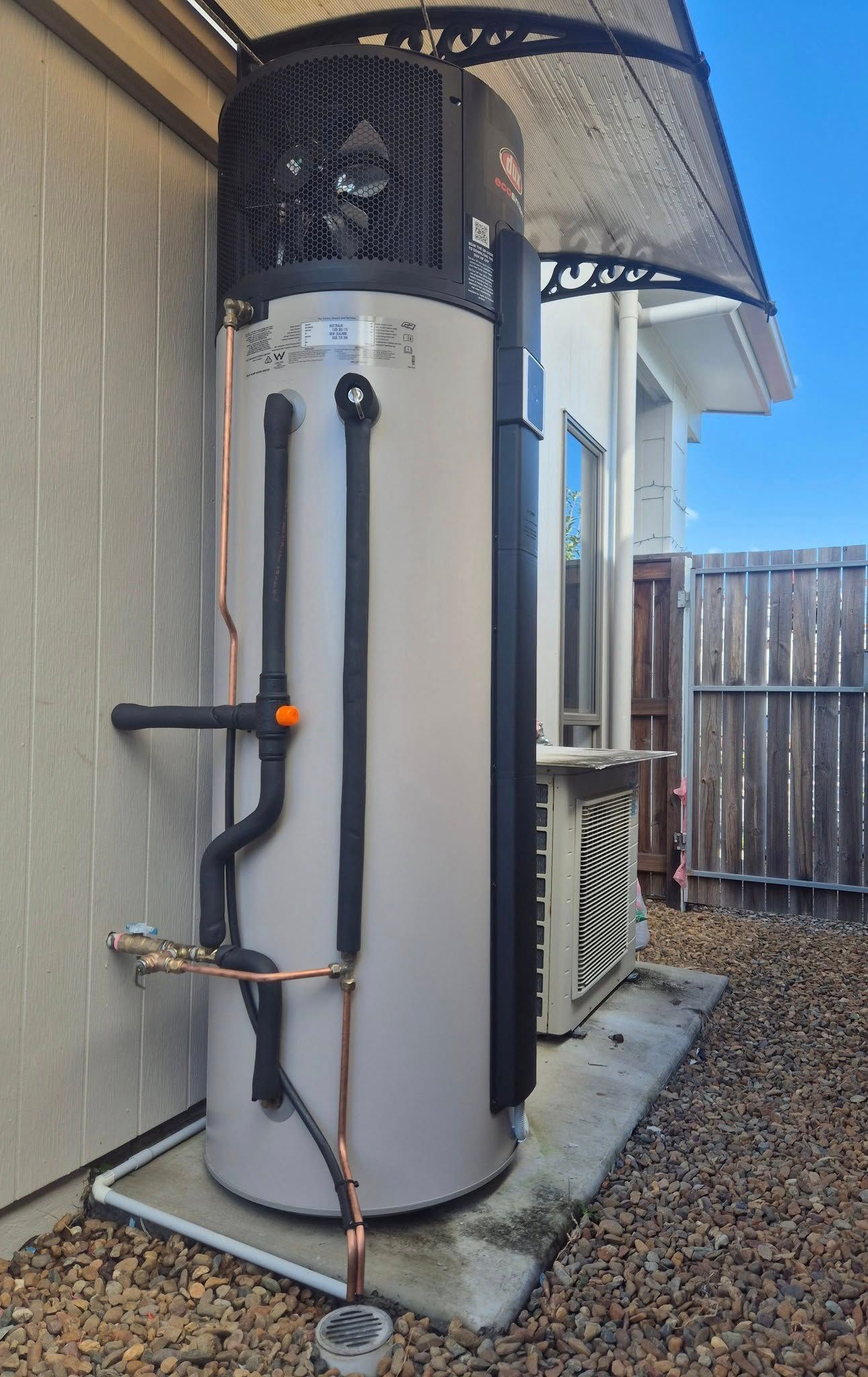 Heat Pump Water Heater Installed Outside a Home — 24/7 Hot Water in Valdora, QLD