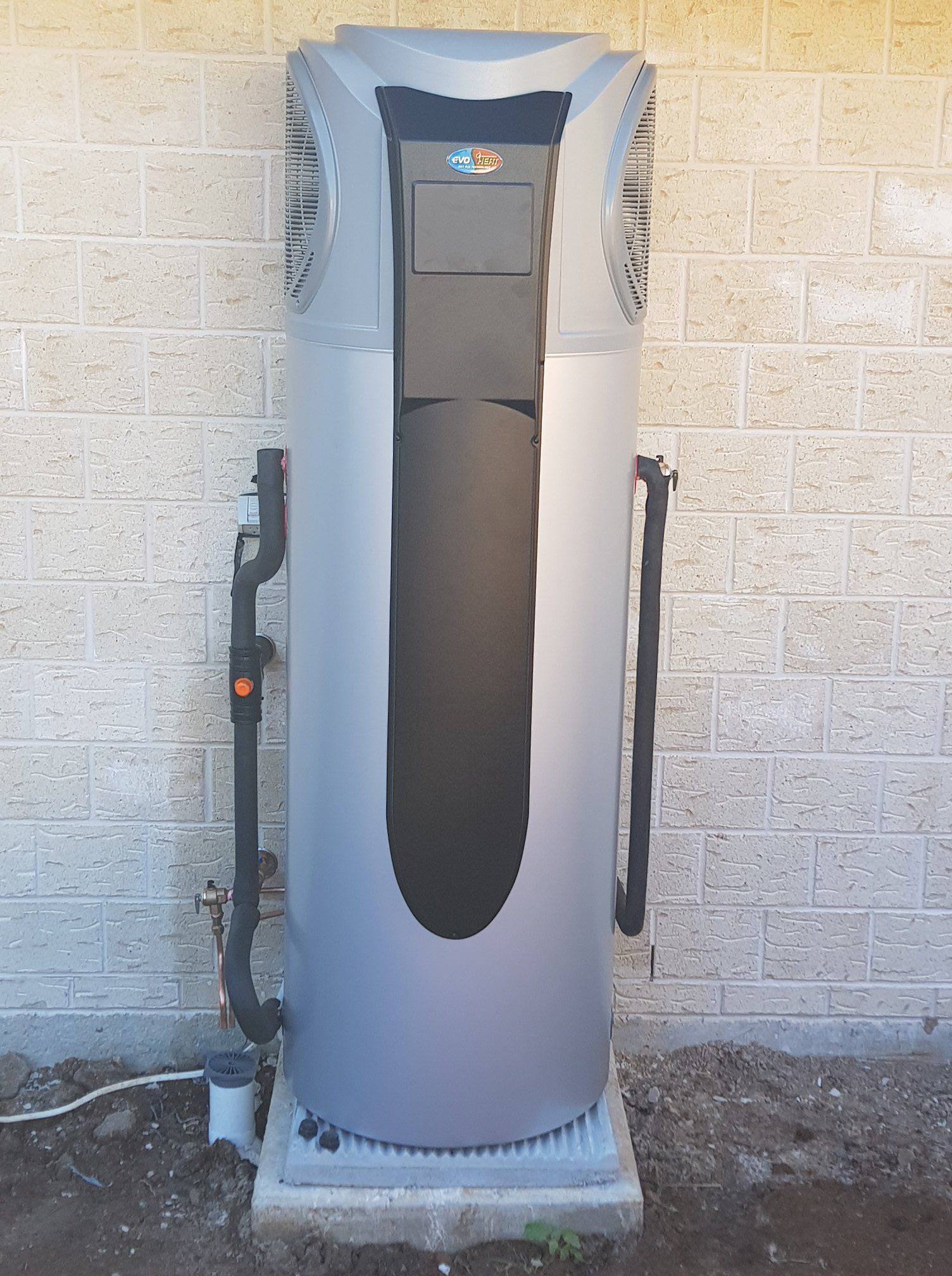 Gray Pool Heater Against a Brick Wall, With Black Pipes and Controls — 24/7 Hot Water in Valdora, QLD