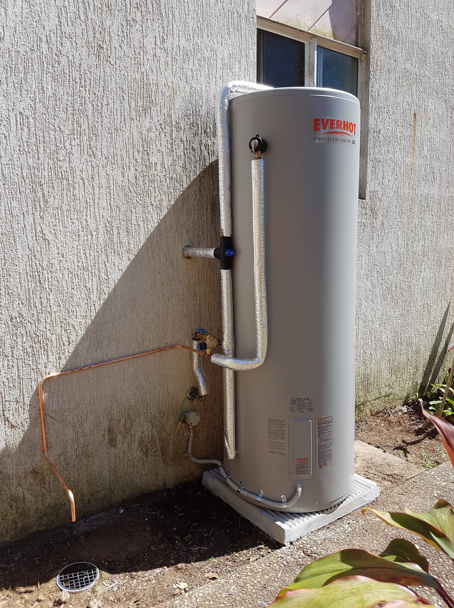 Grey Water Heater Tank Outside a Building — 24/7 Hot Water in Maroochydore, QLD