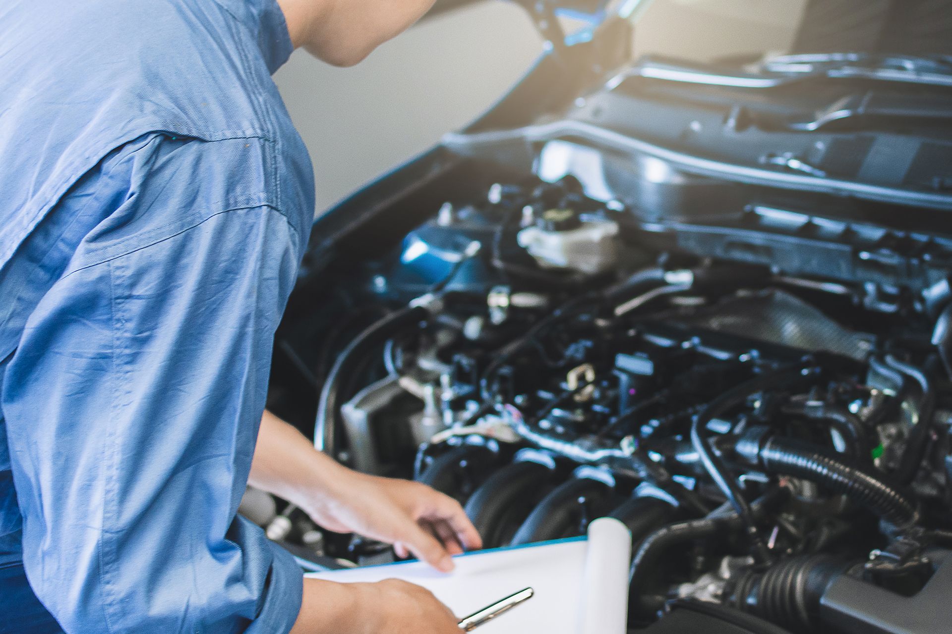 Mechanic Checking Car Engine
