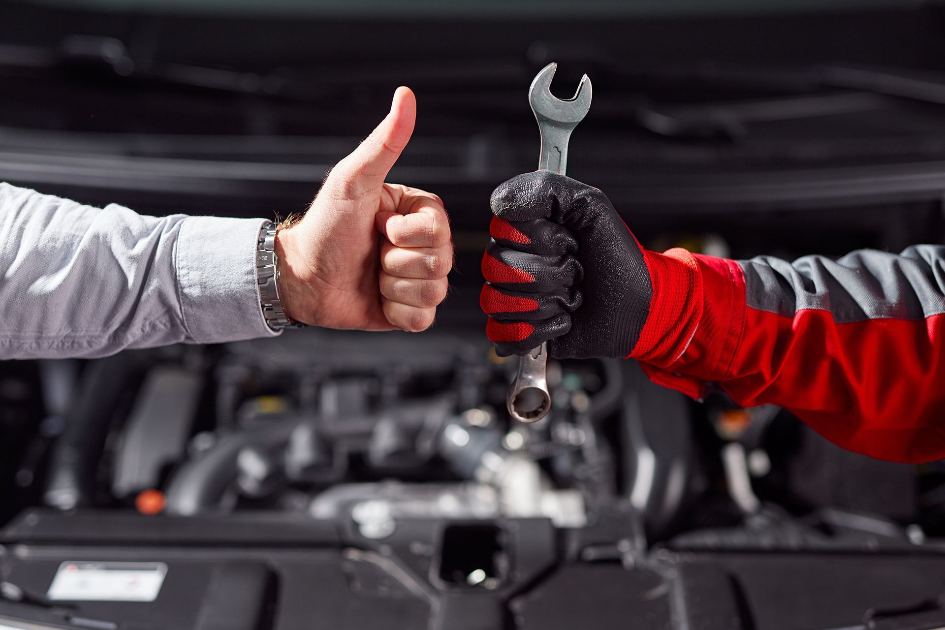 Person Showing Thumb up While Mechanic Holding a Spanner