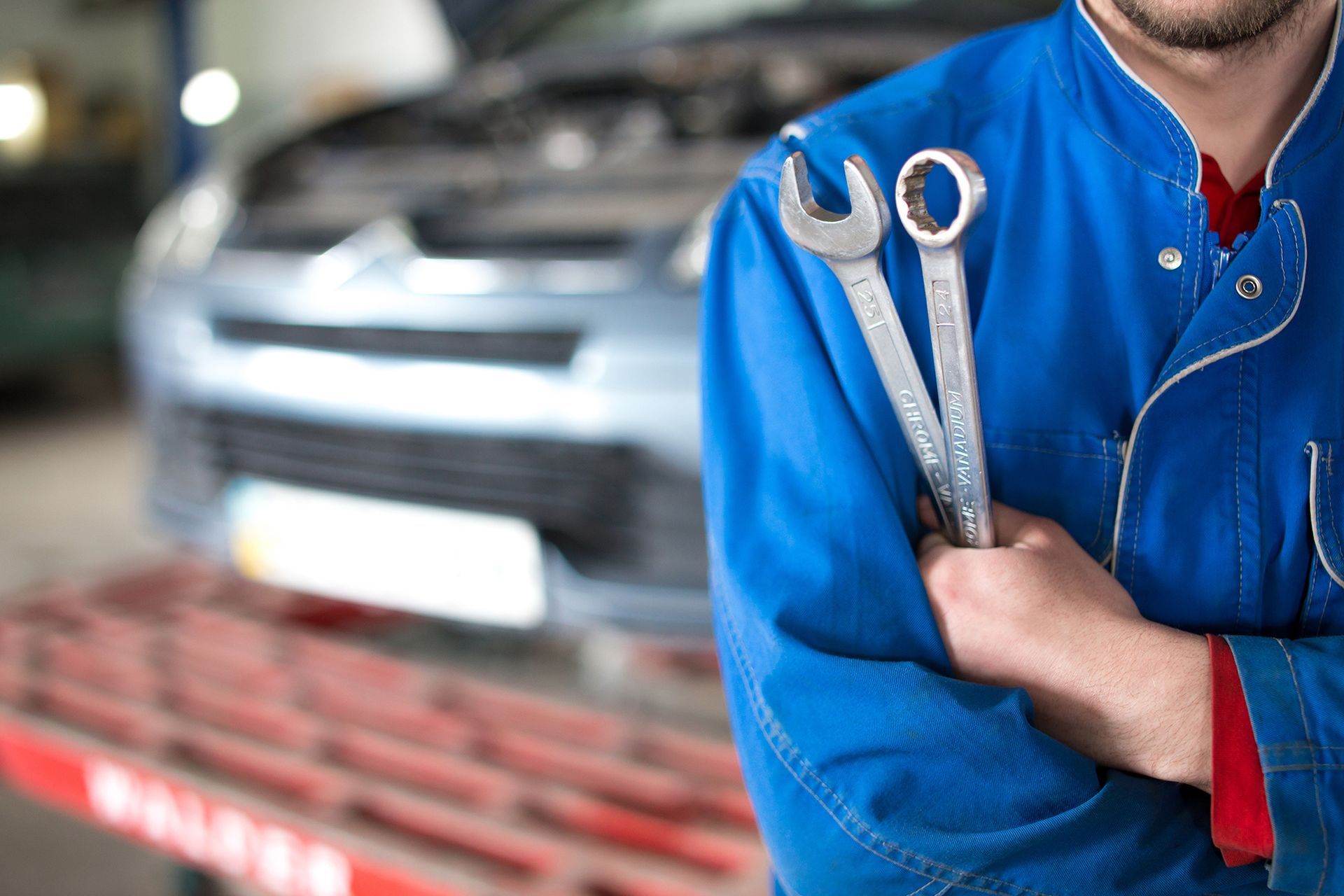 Car Mechanic Holding Two Wrenches