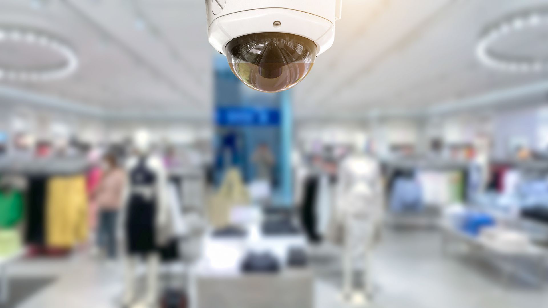 Panoramic view from CCTV security camera with a blurred shop store in the background.