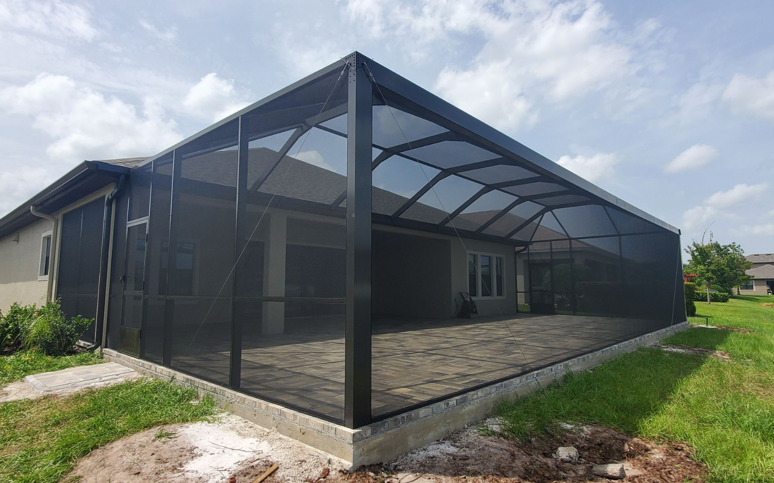 screen cage over a paver patio installation in Lakeland, FL.