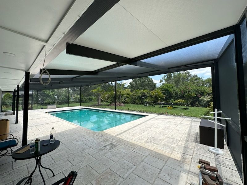 pool enclosure with a composite insulated roof panel installation in Lakeland, FL.