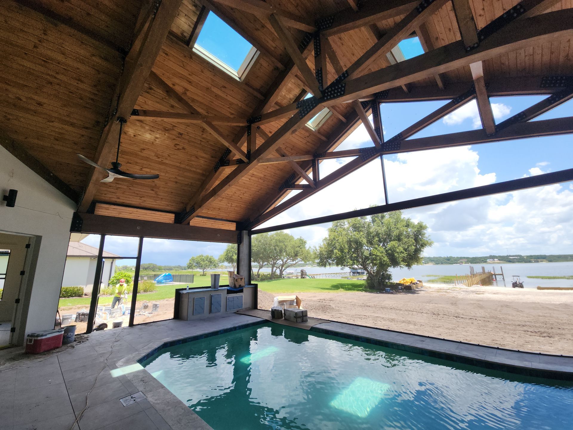 timber frame pool enclosure roof installation in Lakeland, FL.