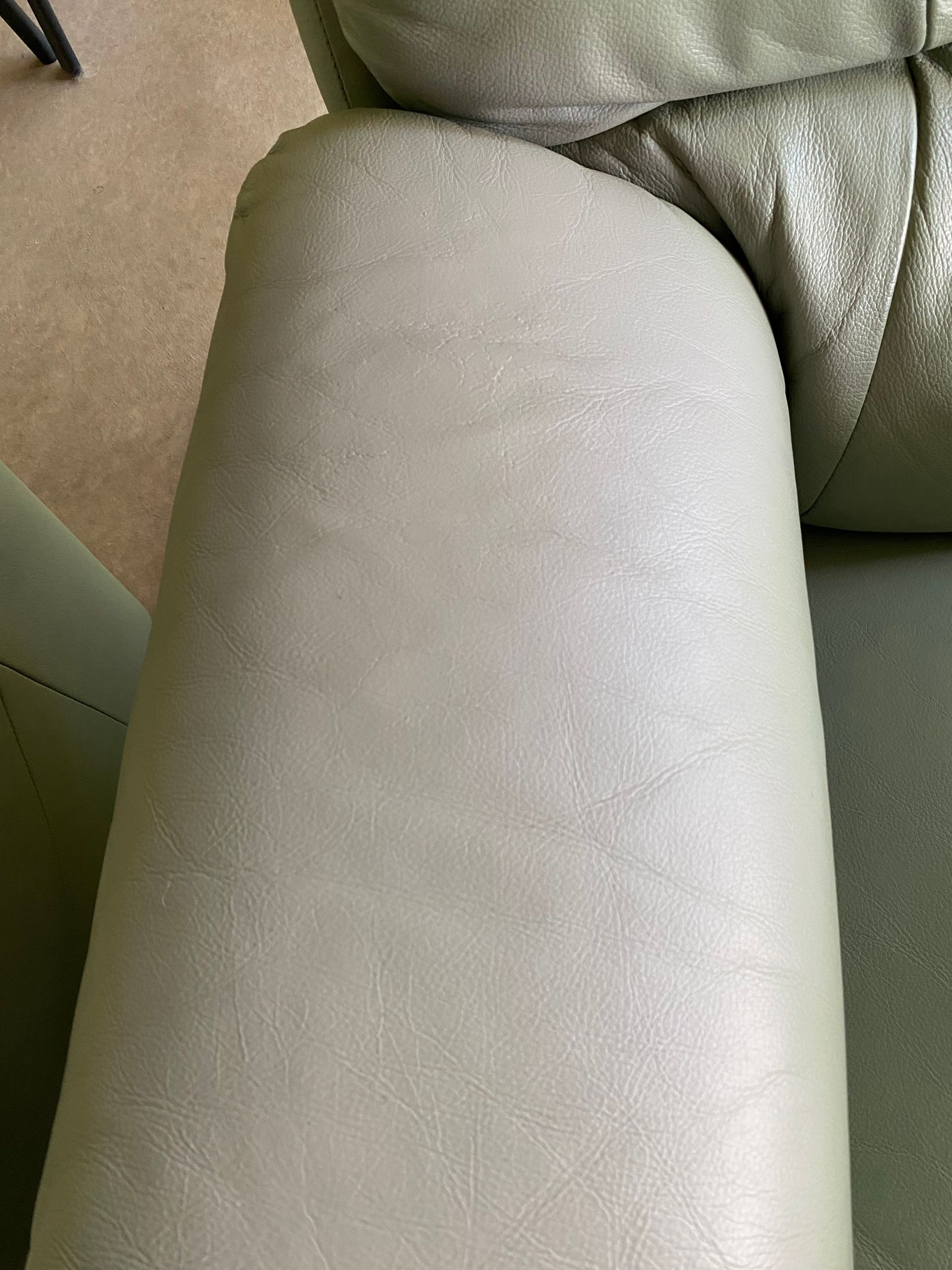 A close up of the arm of a white leather couch. — Furniture & Auto Pride In Port Macquarie, NSW