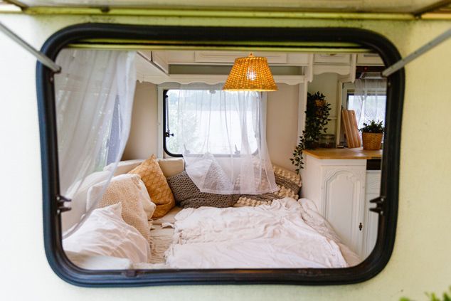 A View of a Bed in a Camper Through a Window — Furniture & Auto Pride in Port Macquarie, NSW