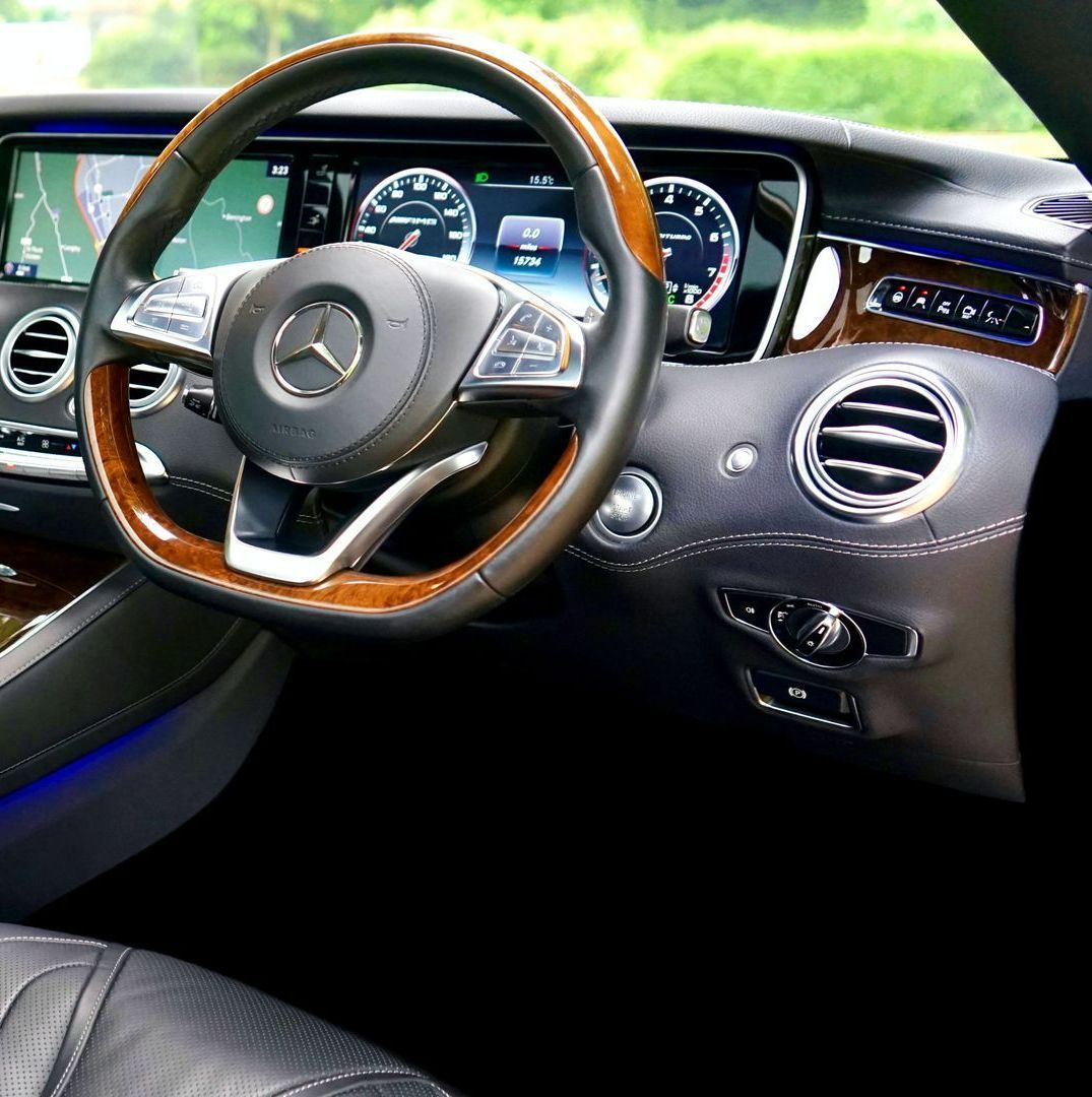 The interior of a mercedes with a wooden steering wheel — Furniture & Auto Pride In Port Macquarie, NSW