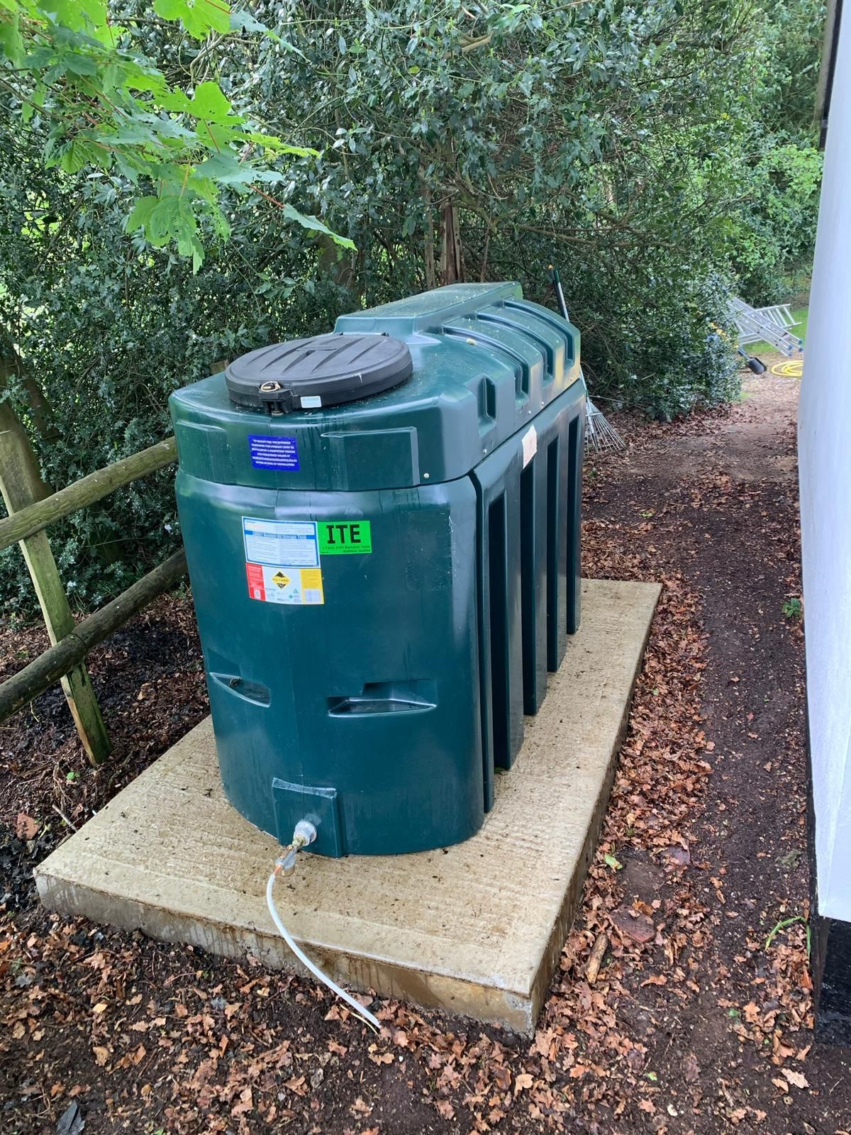 OFTEC-registered oil tank installer fitting a domestic tank