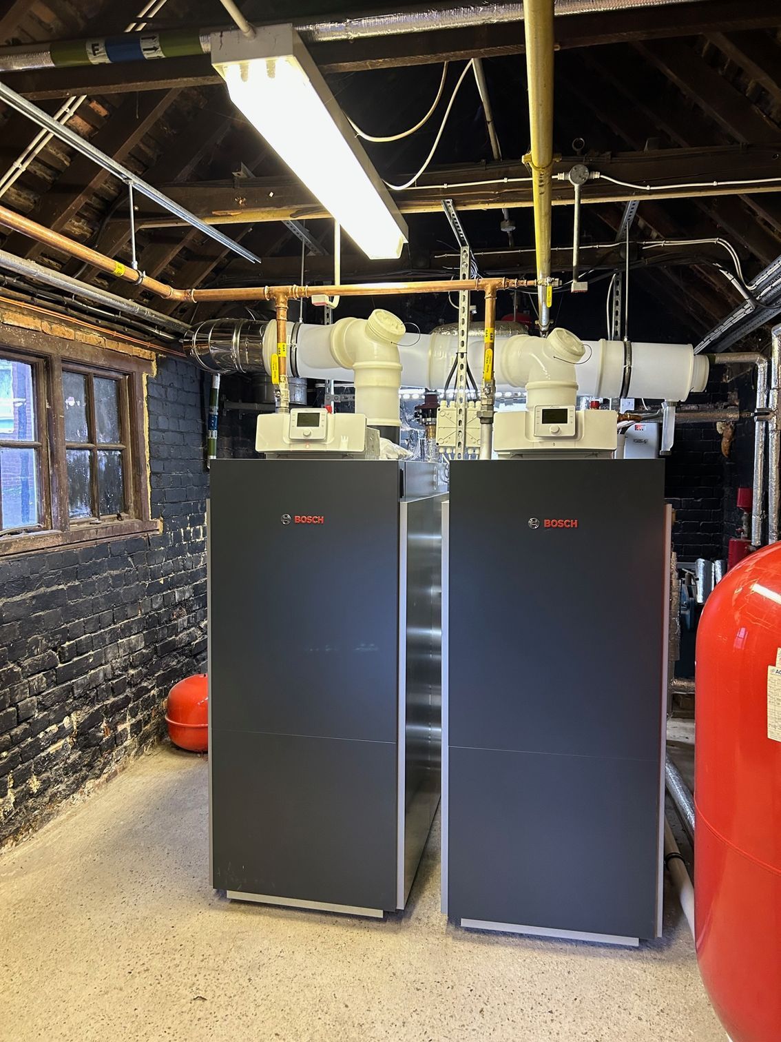 New commercial boiler system installed in a school plant room