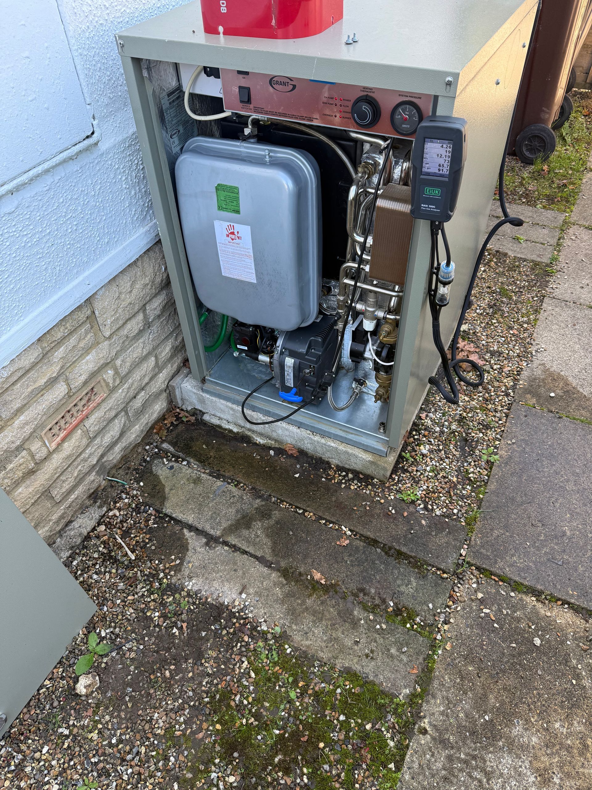 OFTEC engineer carrying out oil boiler service in Wargrave home