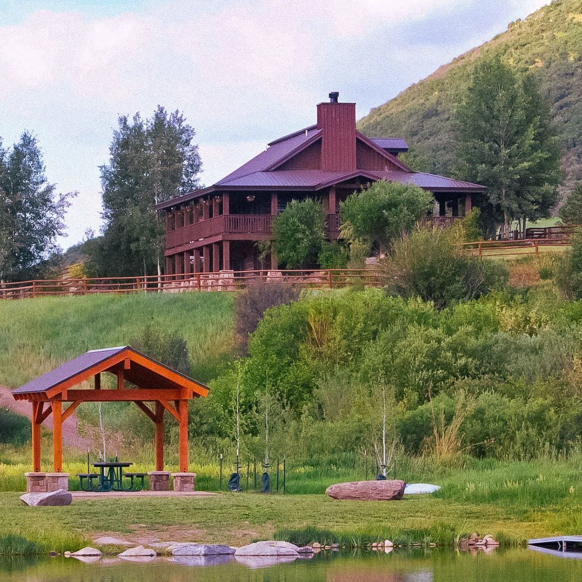 A large house with a gazebo in front of it