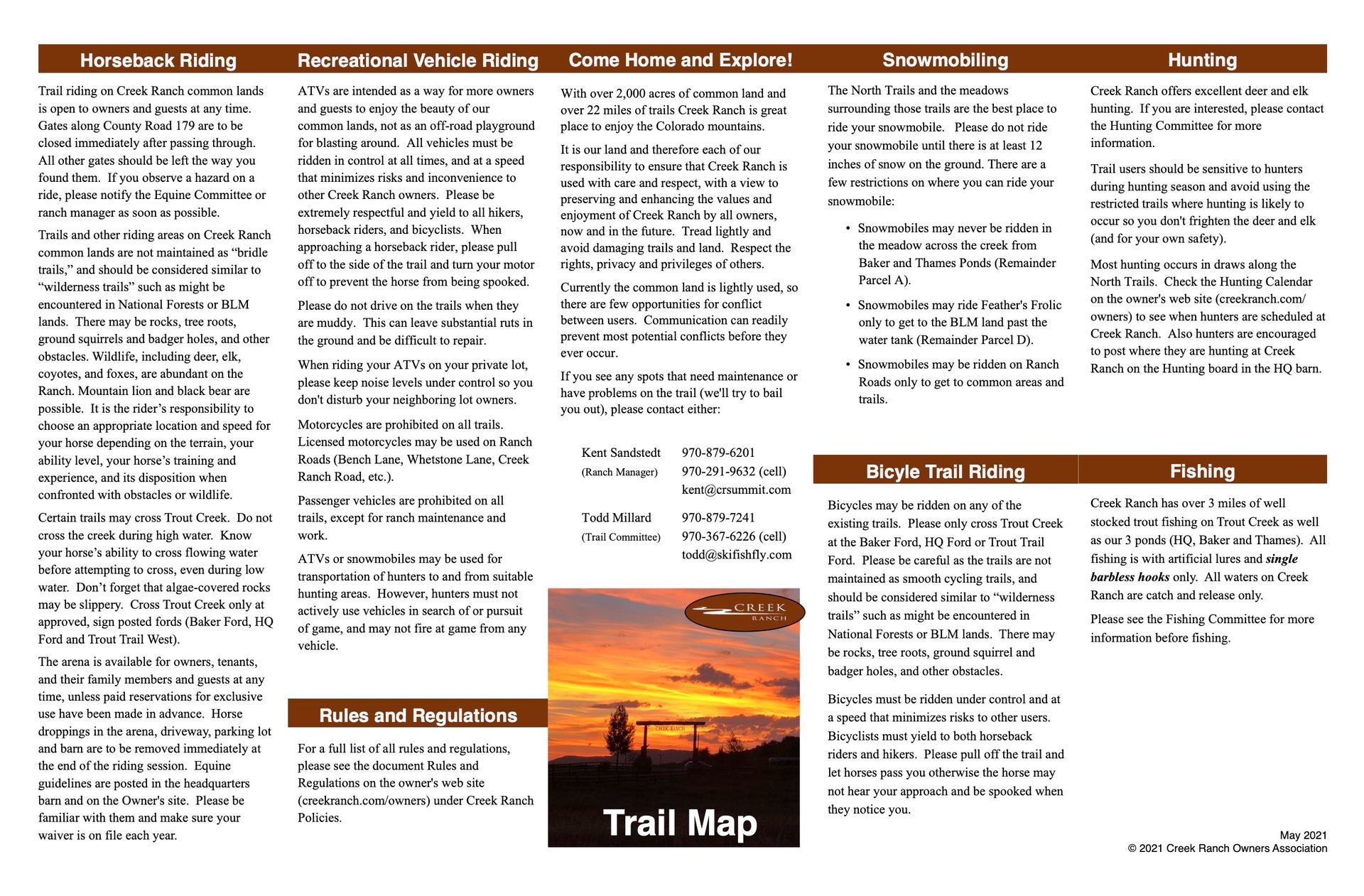 A trail map with a sunset in the background