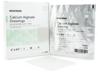 McKesson calcium alginate wound dressings box and individual package with a white dressing.