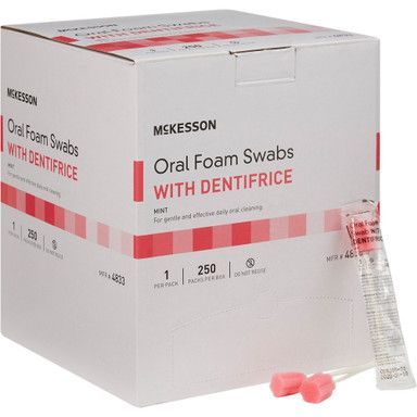 Box of McKesson oral foam swabs with dentifrice, white box with red accents. Several pink swabs visible.