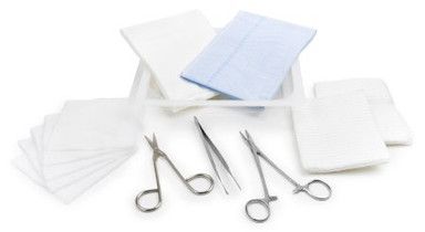 Surgical kit with gauze pads, scissors, and forceps on a white background.