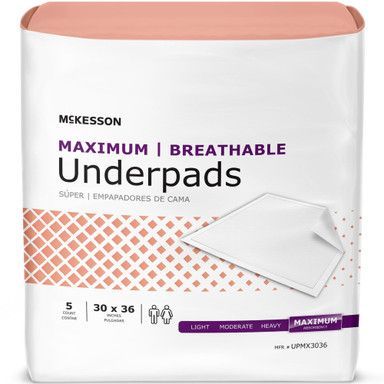 Package of McKesson Maximum Breathable underpads, white and peach colors.
