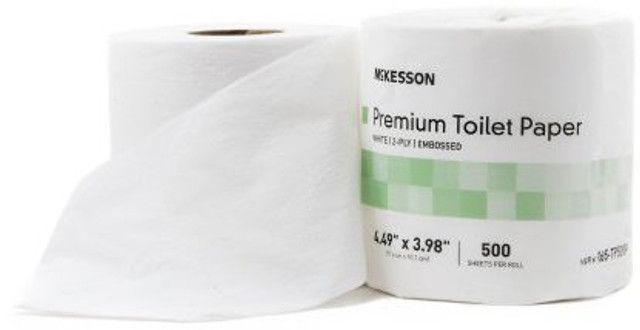 Two rolls of white toilet paper, one unrolled. The brand is McKesson Premium.