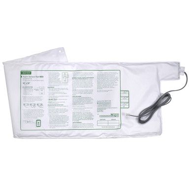White electric mattress pad with attached cord; product instructions on the pad's surface.