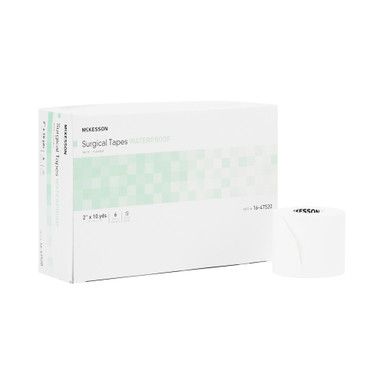 Box of surgical tapes, white with green accents, next to a single roll.