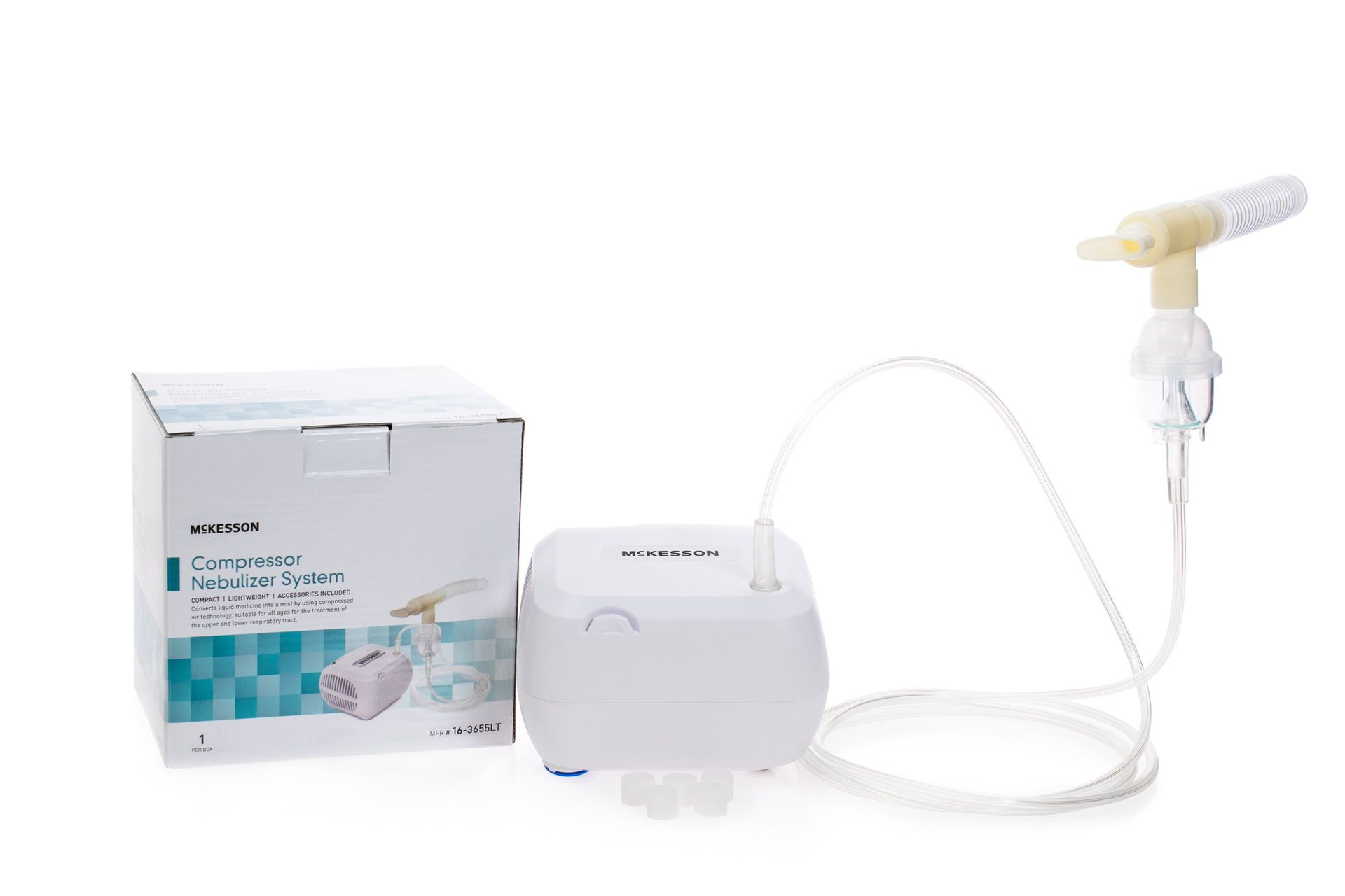 White nebulizer machine with attached tube and mouthpiece next to a box.