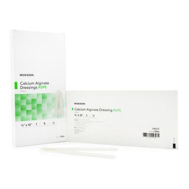 Box of McKesson calcium alginate wound dressings, opened to show the sterile, white strips.