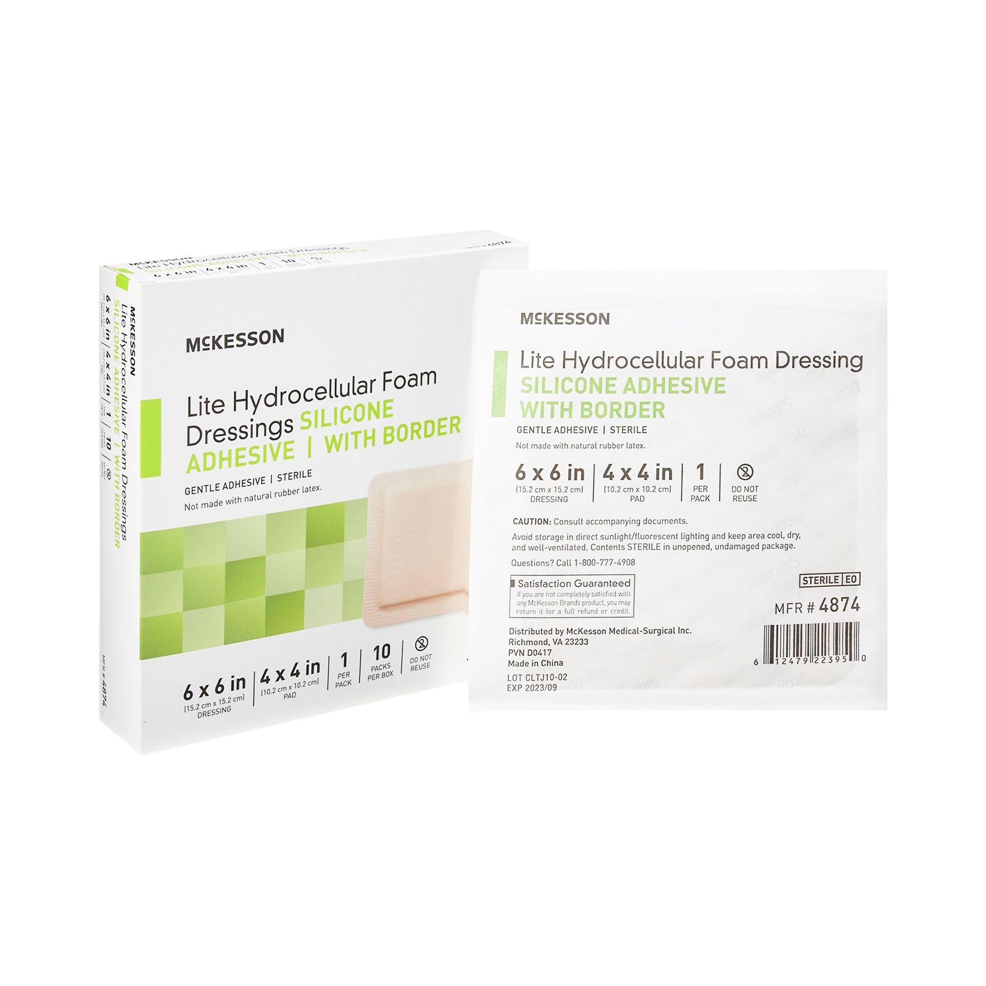 Box of medical wound dressings. White box with green accents and a dressing packet.
