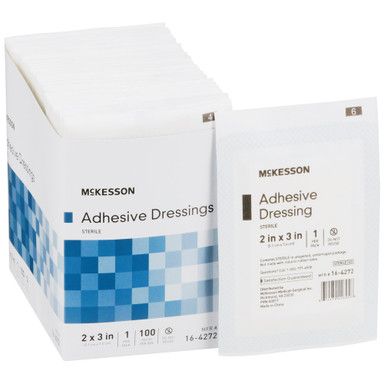 Box of McKesson adhesive dressings, white packaging, blue accents. Single dressing shown, labeled 