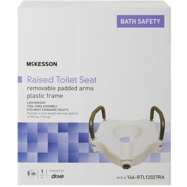 Boxed McKesson raised toilet seat with padded arms and plastic frame.