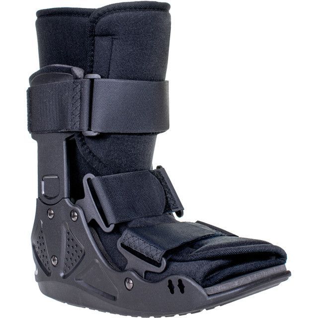 Black medical walking boot with adjustable straps.