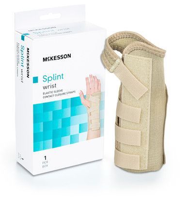 Wrist splint with beige straps next to its white and blue box; 