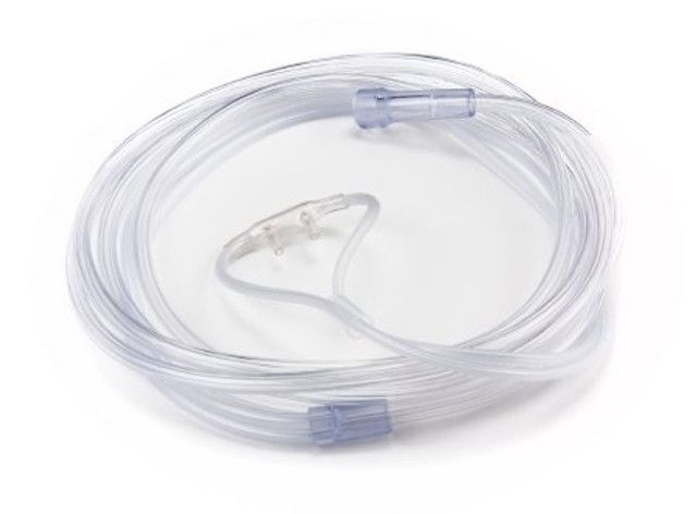 Clear plastic nasal cannula tubing coiled on a white surface.