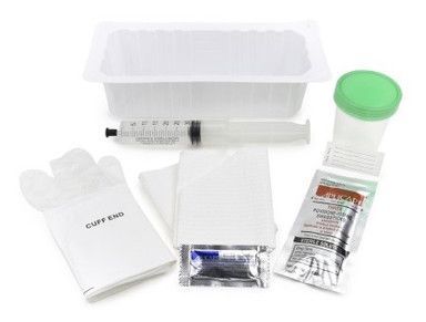 Medical kit: tray, syringe, cup, gloves, swabs, and packets.