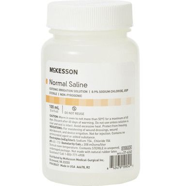 White bottle of McKesson Normal Saline solution, 0.9% sodium chloride, for wound irrigation.
