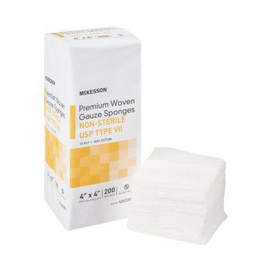 McKesson gauze sponges, non-sterile, in a white and yellow box, with a stack of sponges beside it.