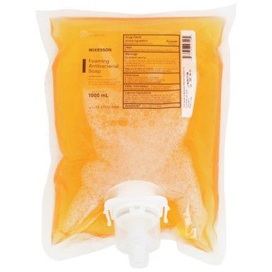 Orange foaming antibacterial soap refill bag with white dispenser spout.