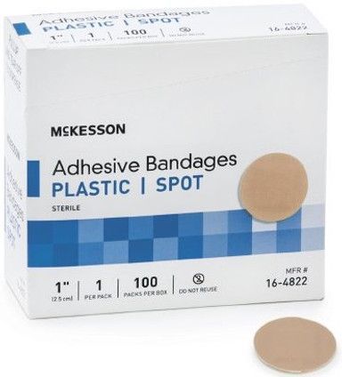 Box of McKesson adhesive bandages; tan spot bandages, 1 inch, 100 count.