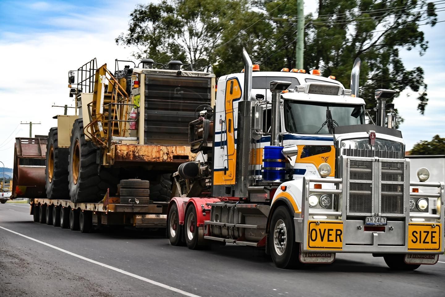 Larger Truck Carrying a Bulldozer — Rutherford, NSW — Goldsprings Heavy Haulage