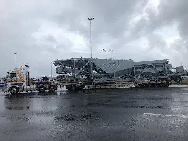 A Semi Truck is Carrying a Large Machine on a Trailer — Rutherford, NSW — Goldsprings Heavy Haulage