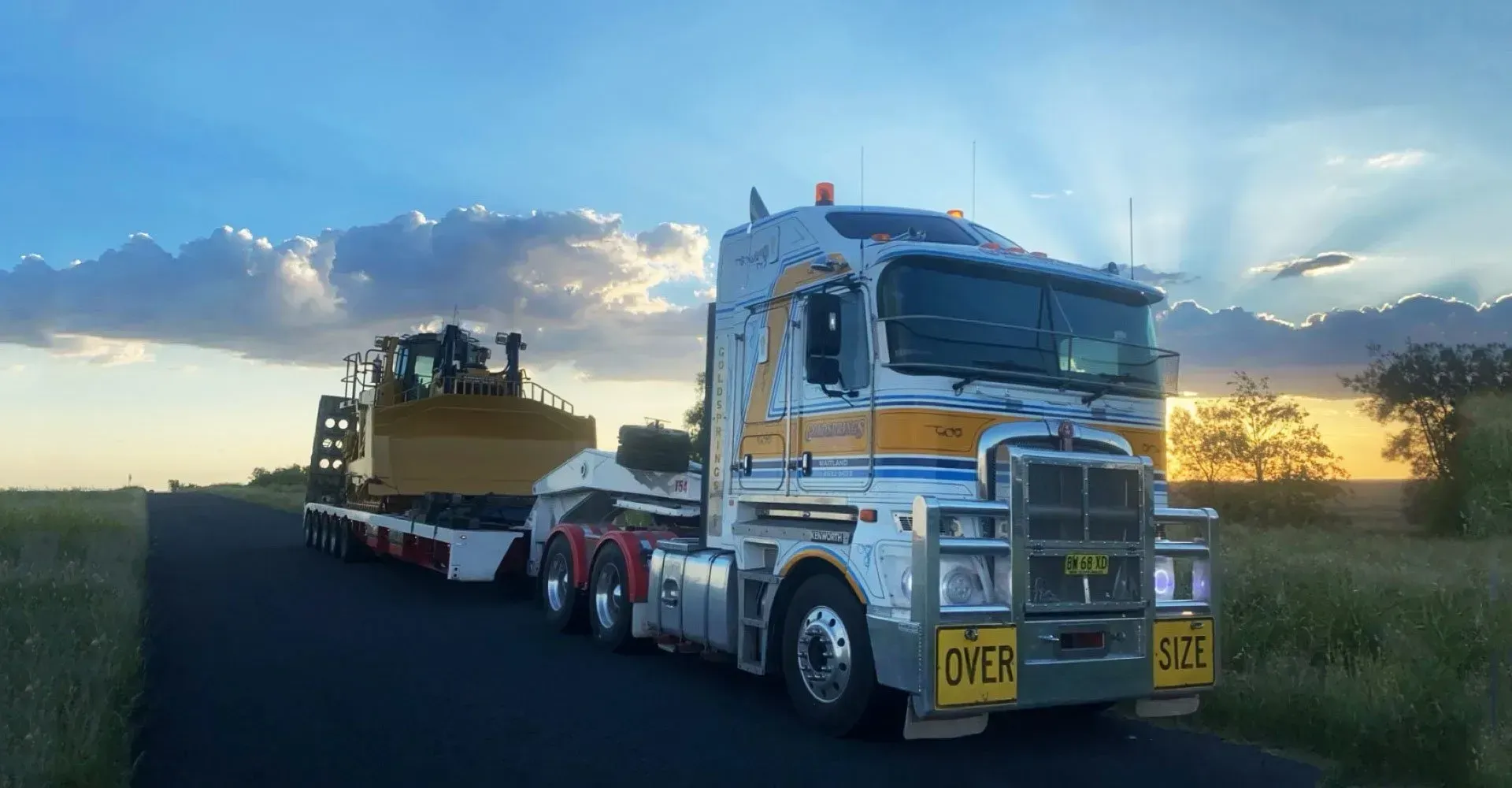 A Semi Truck is Carrying a Bulldozer on the Trailer — Rutherford, NSW — Goldsprings Heavy Haulage
