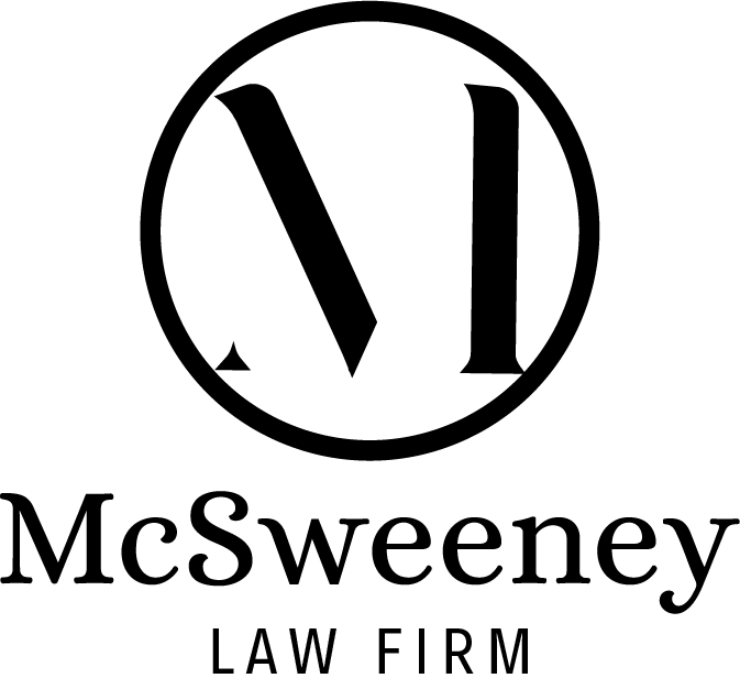 A black and white logo for a law firm with a letter m in a circle. McSweeney Lawfirm