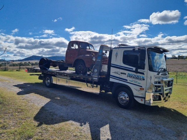 Tow Truck Towing A Broken Down Car — Towing in Kempsey