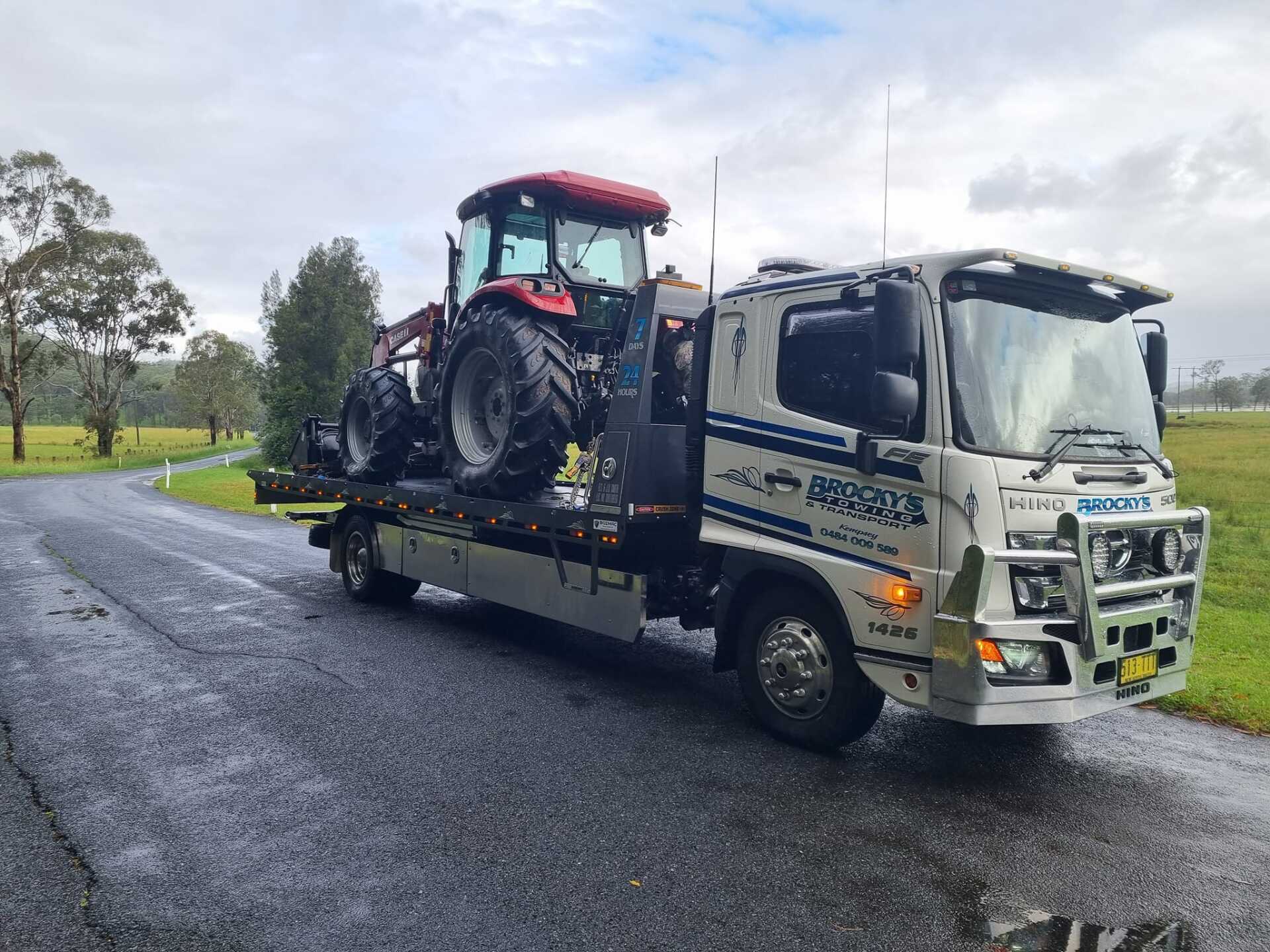 Tractor Being Transported on a Flatbed Truck — Towing in Kempsey