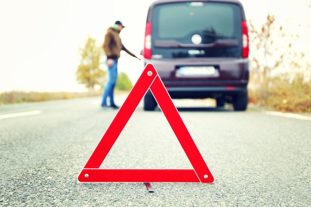 Traffic Warning Sign On Road With Broken Down Car — Towing in Kempsey